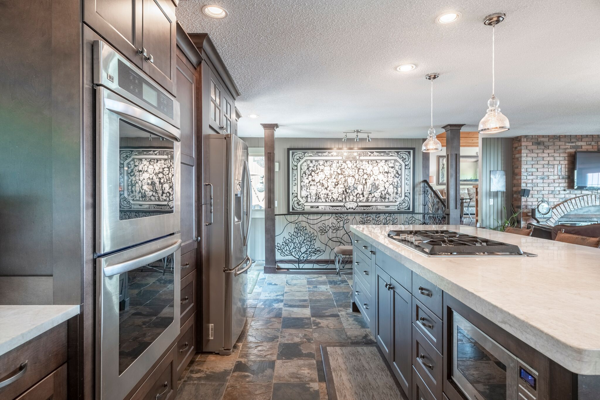 Kitchen with double ovens and stainless refrigerator