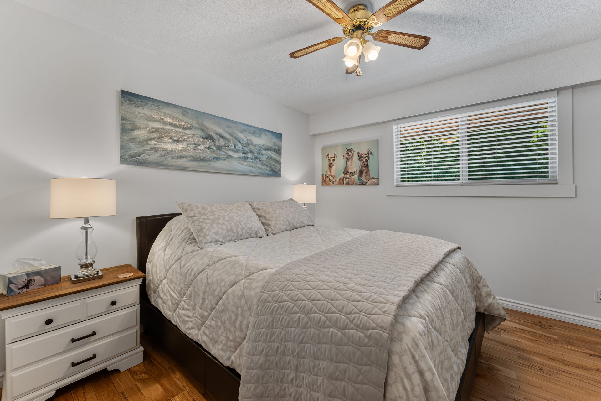 Queen bedroom second angle with ceiling fan and closet